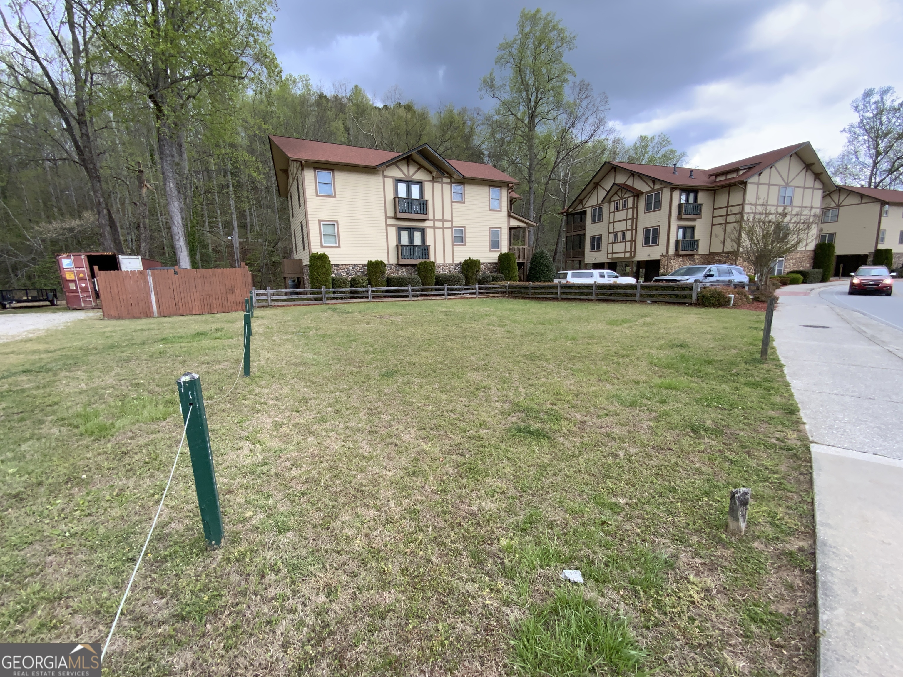 0 Edelweiss Strasse Helen, GA 30545 - Photo 6 of 8 a front view of a house with a yard and trees
