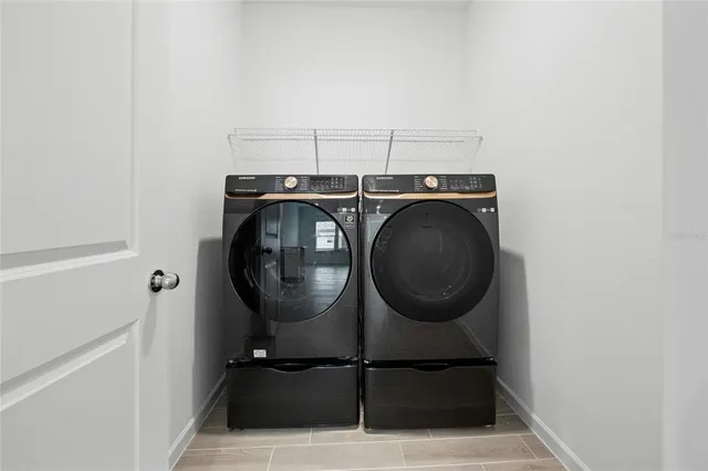 a utility room with dryer and washer