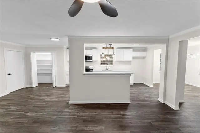 a view living room with furniture and wooden floor