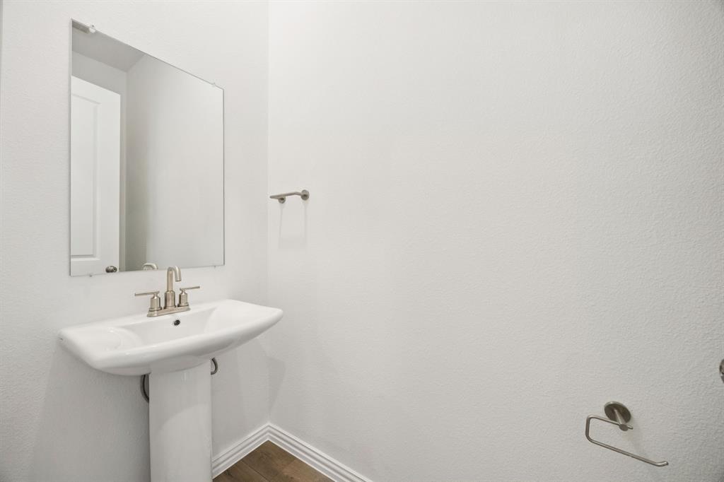 1164 Daybreak Drive Allen, TX 75013 - Photo 13 of 28 a bathroom with a sink and a mirror