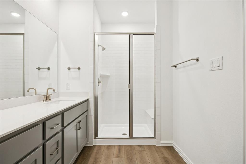 1164 Daybreak Drive Allen, TX 75013 - Photo 21 of 28 a bathroom with a sink and a mirror
