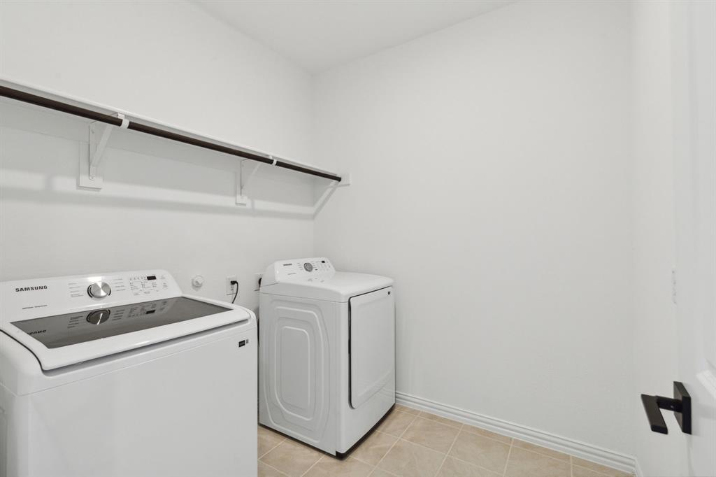 1164 Daybreak Drive Allen, TX 75013 - Photo 23 of 28 a utility room with dryer and washer