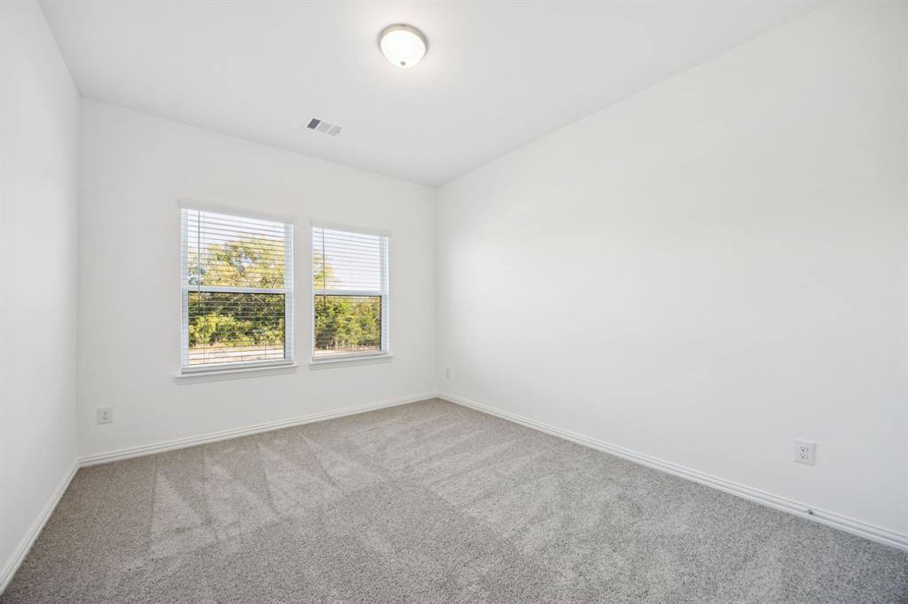 1164 Daybreak Drive Allen, TX 75013 - Photo 25 of 28 an empty room with windows