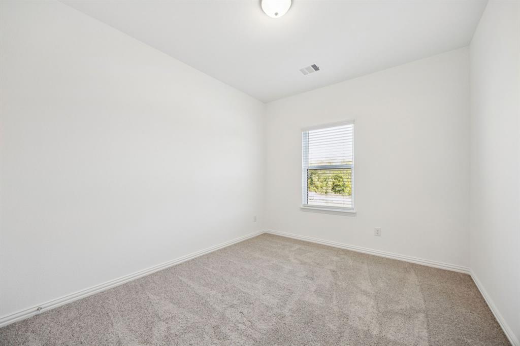 1164 Daybreak Drive Allen, TX 75013 - Photo 26 of 28 an empty room with a window