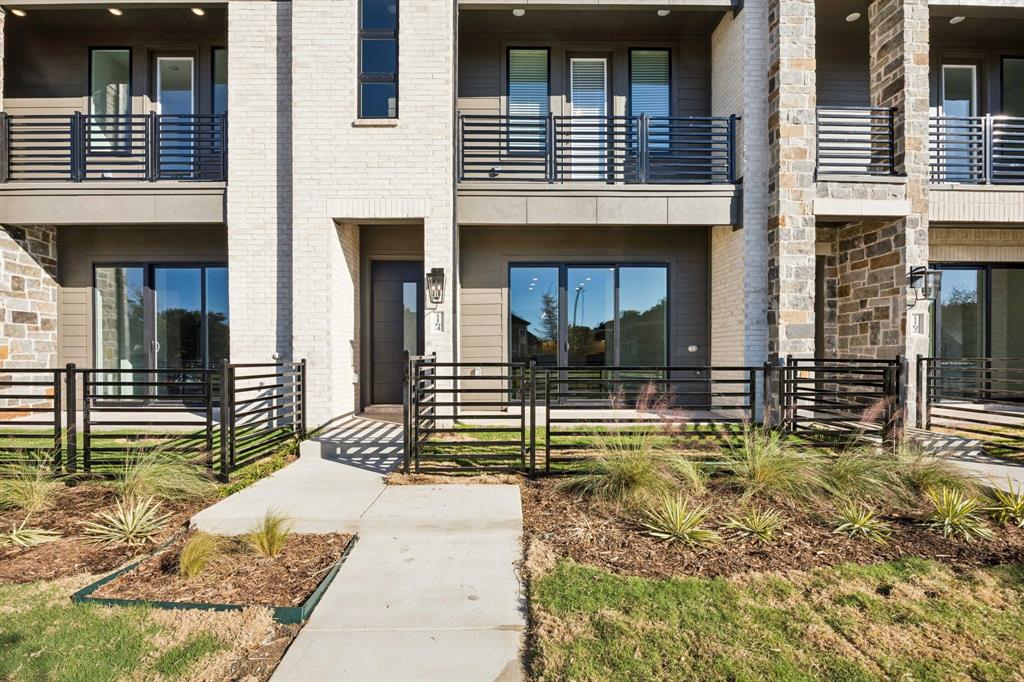 1164 Daybreak Drive Allen, TX 75013 - Photo 4 of 28 a view of a house with a large window and a yard
