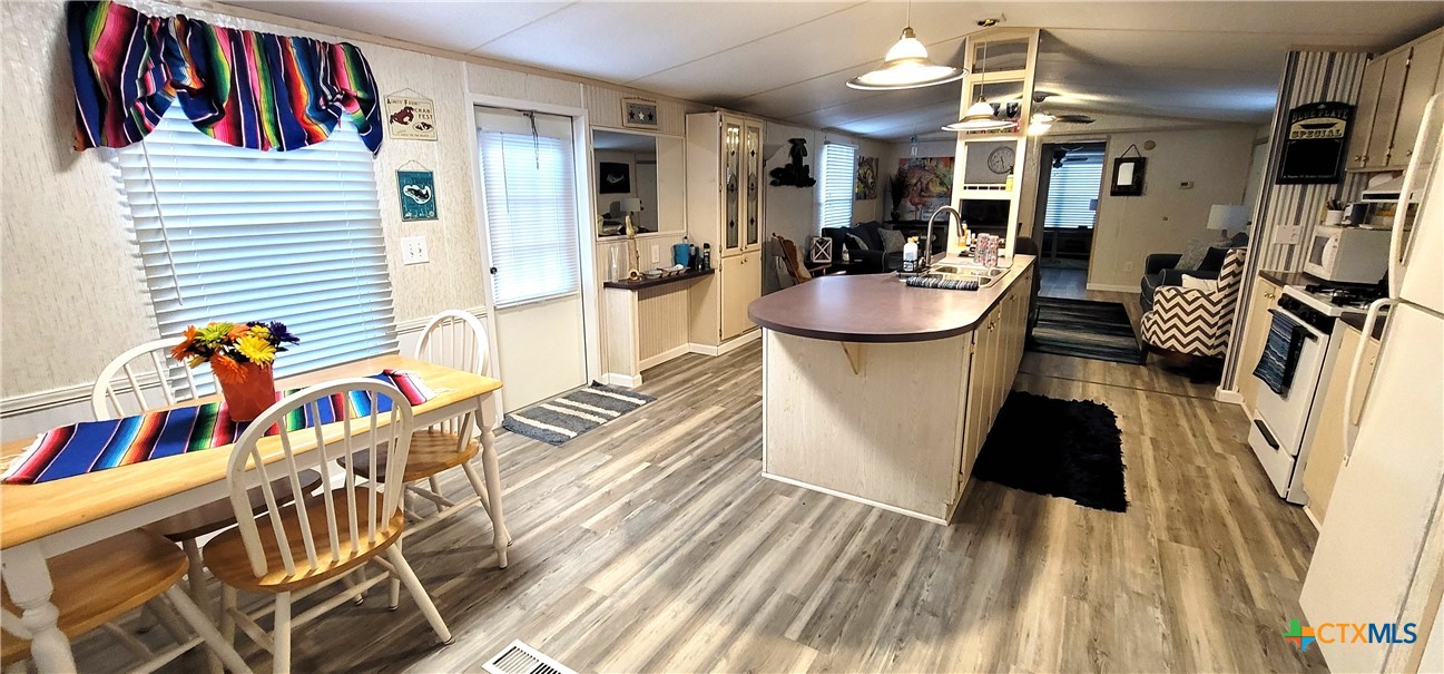 406 Denver Avenue Seadrift, TX 77983 - Photo 12 of 24 a view of a living room and dining room