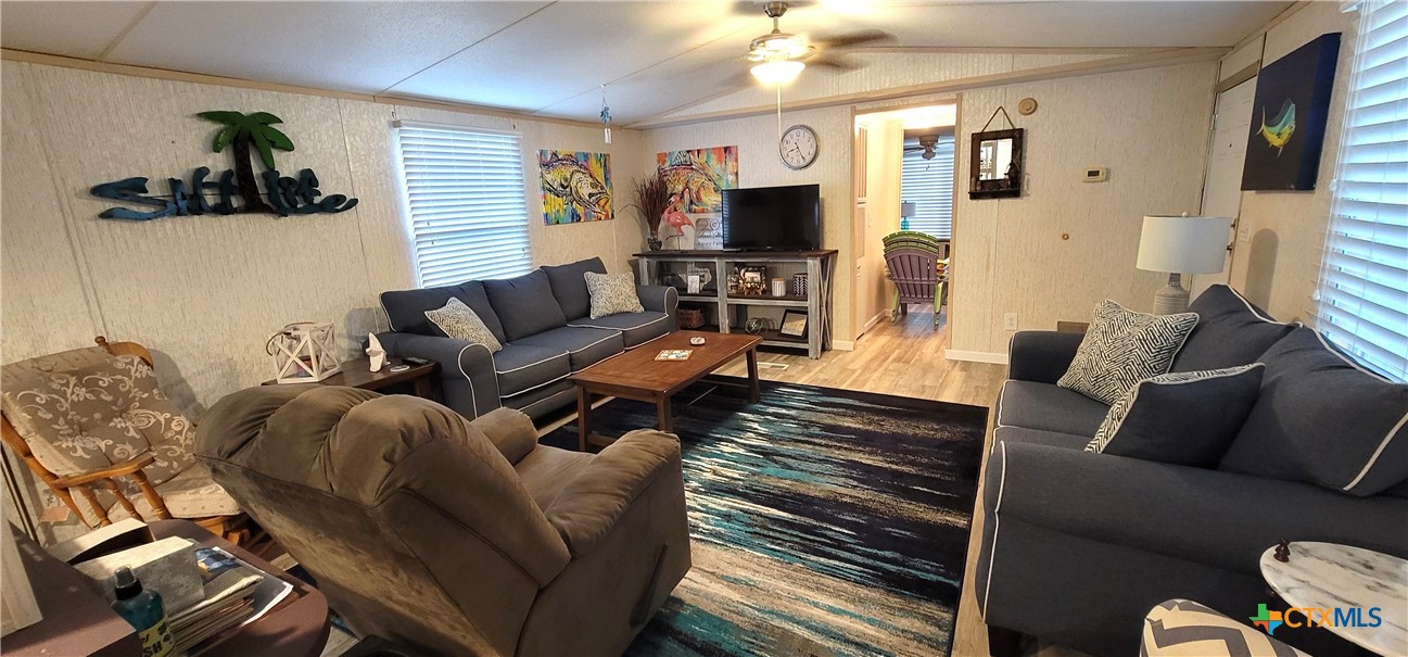 406 Denver Avenue Seadrift, TX 77983 - Photo 5 of 24 a living room with furniture and a flat screen tv