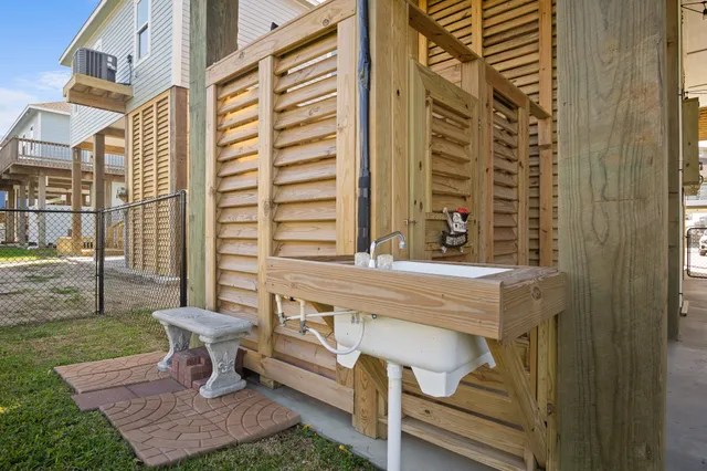 a living room with couches and large windows