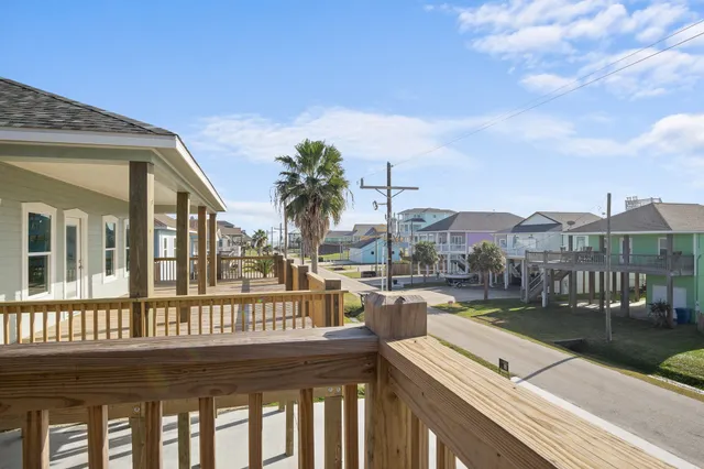 a view of a swimming pool with outdoor seating