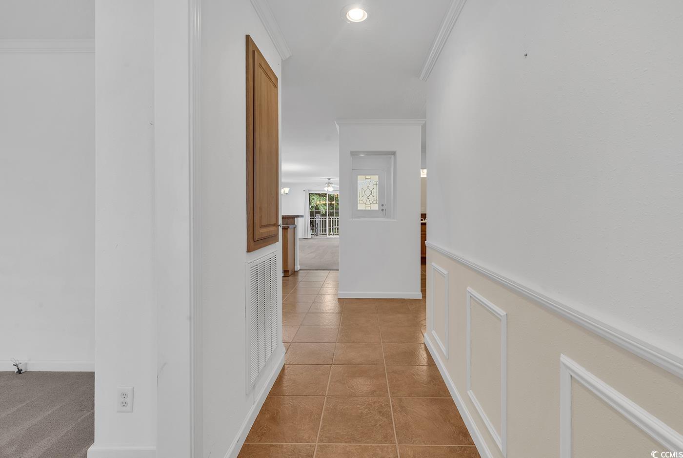 301 Walden Lake Road Conway, SC 29526 - Photo 2 of 37 Hall featuring ornamental molding and light tile patterned flooring