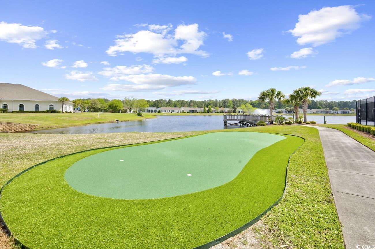 301 Walden Lake Road Conway, SC 29526 - Photo 32 of 37 View of community with a putting green, a water view, a lawn, and golf course view
