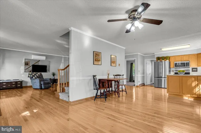 a view of a livingroom with furniture and a flat screen tv