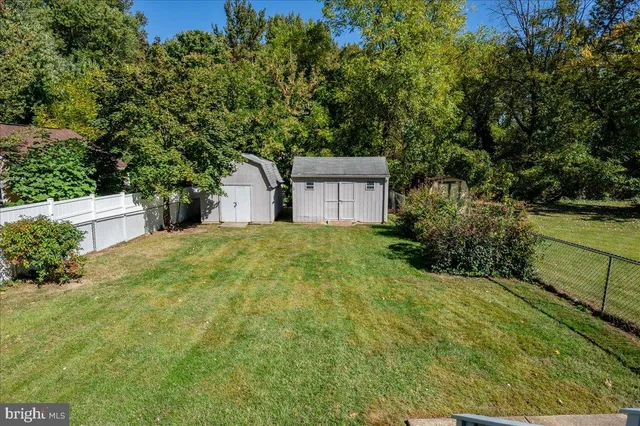 an aerial view of a house with a yard and garden