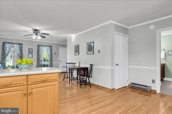 a view of a livingroom with furniture and a window