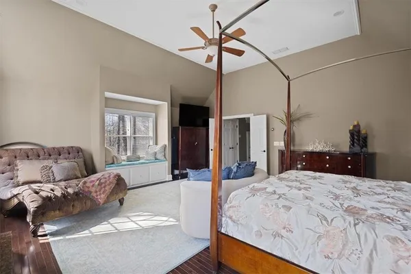 a view of a livingroom with furniture and a flat screen tv