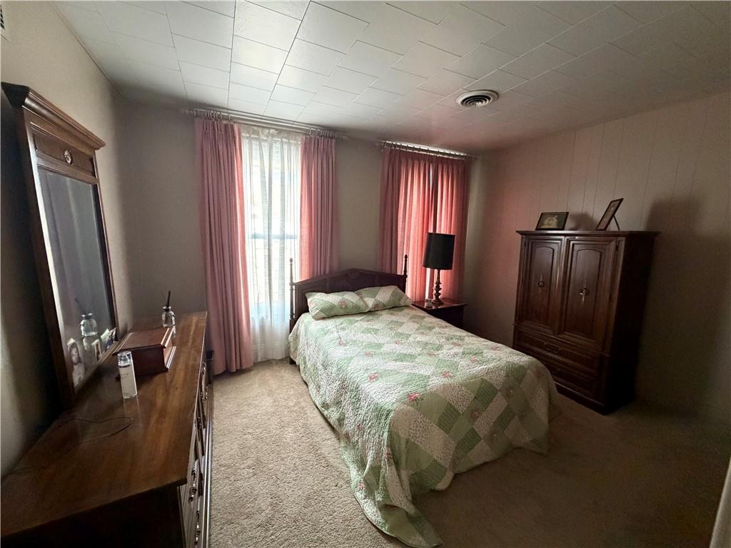 149 Chess Street Monongahela, PA 15063 - Photo 17 of 35 a bedroom with a bed dresser and a flat tv screen