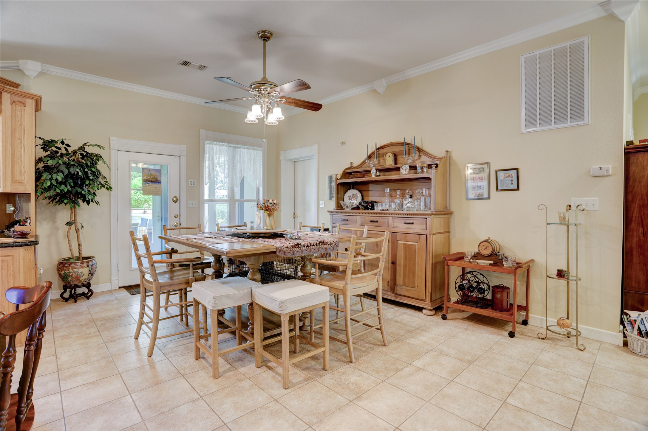 4854 Coshatte Road Bellville, TX 77418 - Photo 15 of 52 a view of a dining room with furniture and a chandelier
