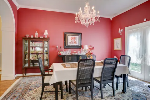 a living room with furniture kitchen view and a window