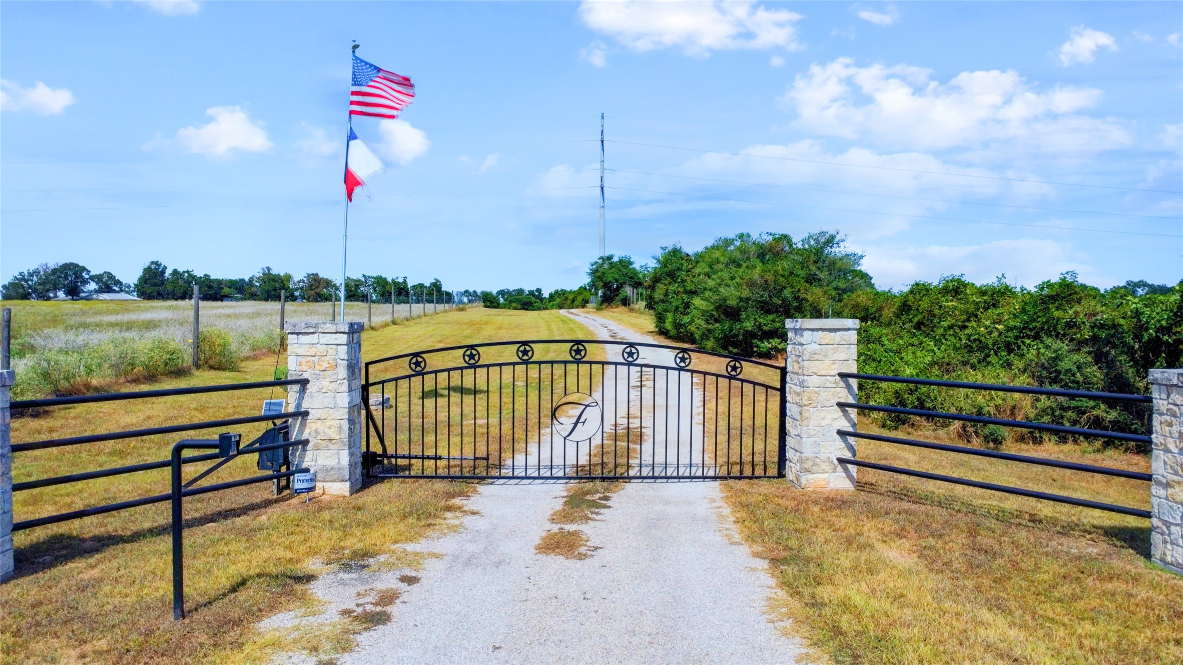 4854 Coshatte Road Bellville, TX 77418 - Photo 2 of 52 a view of a pathway with a wrought fence