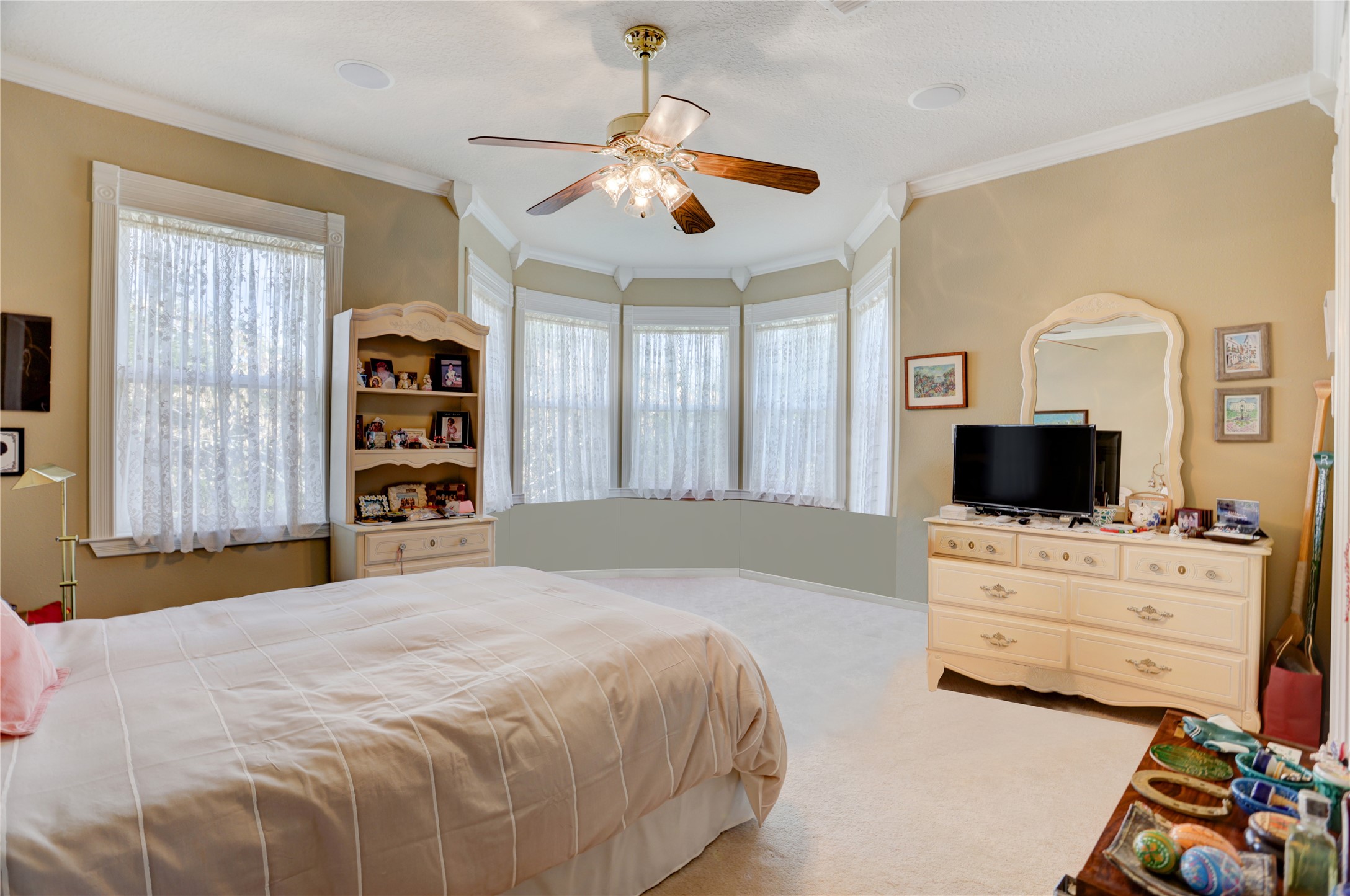 4854 Coshatte Road Bellville, TX 77418 - Photo 30 of 52 a bedroom with a bed a flat screen tv and dresser
