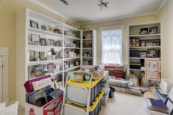 a room with furniture and a book shelf