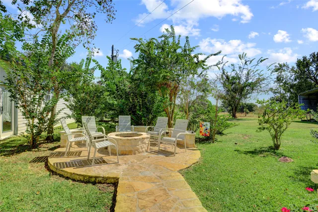a view of a swimming pool with a patio