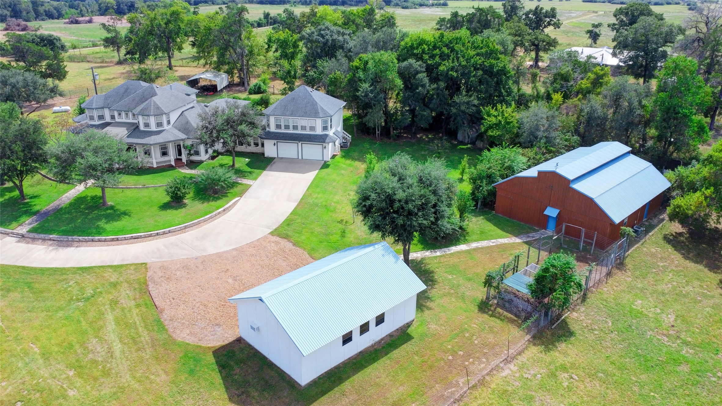 4854 Coshatte Road Bellville, TX 77418 - Photo 4 of 52 an aerial view of a house with garden space and street view