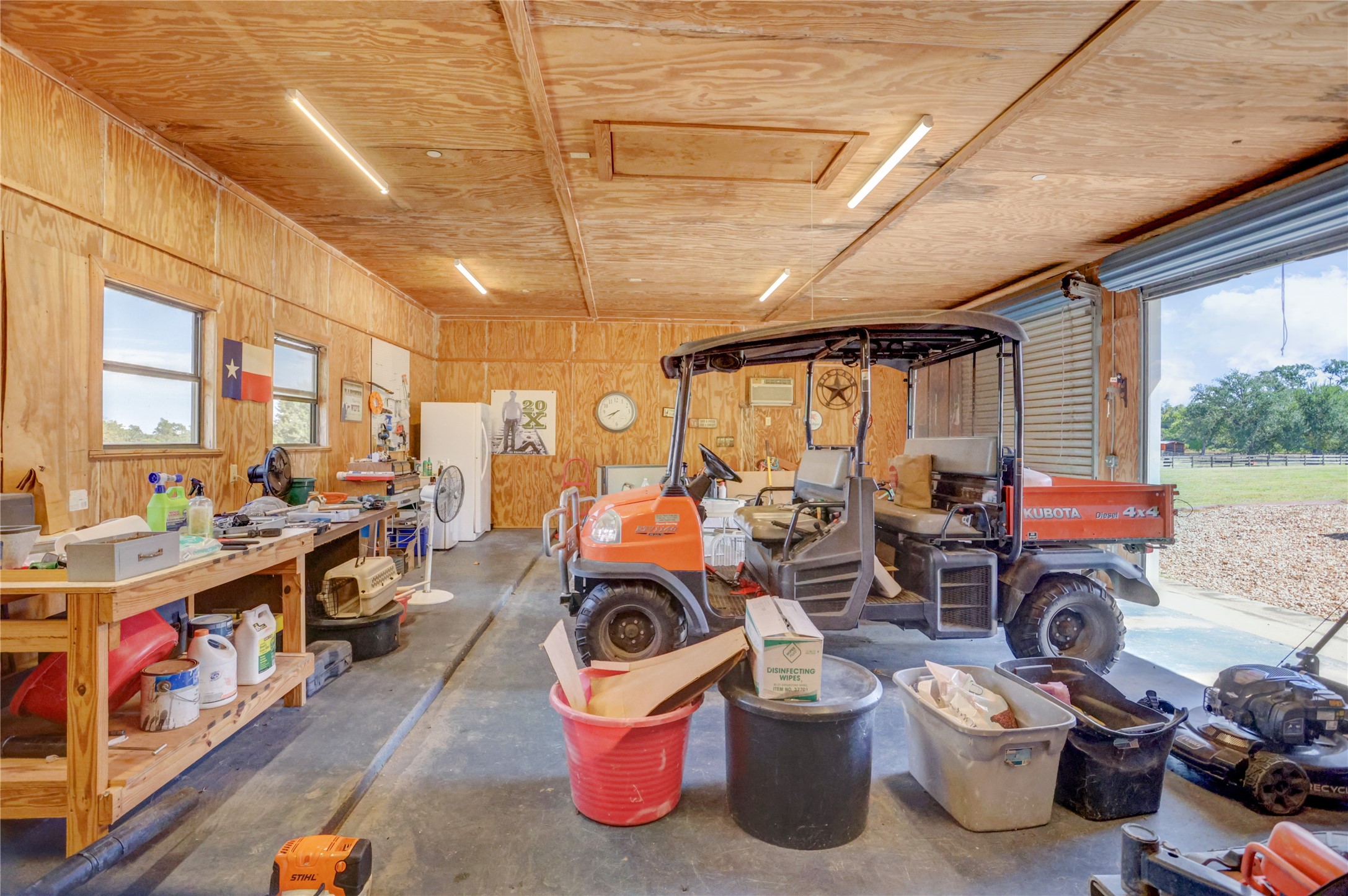 4854 Coshatte Road Bellville, TX 77418 - Photo 42 of 52 a view of a storage room with lots of stuff