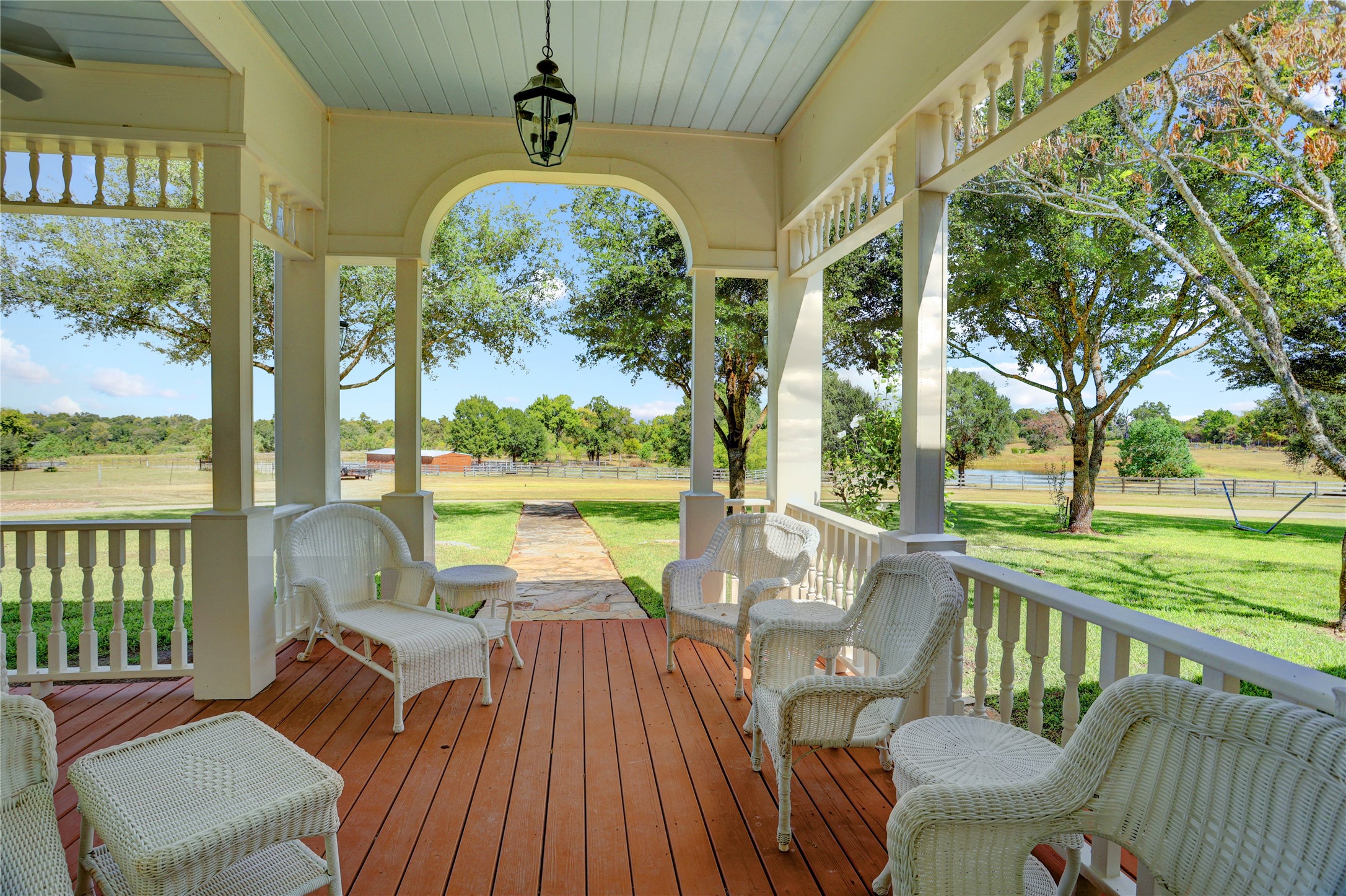 4854 Coshatte Road Bellville, TX 77418 - Photo 8 of 52 a view of a chairs and table in patio with a lake view