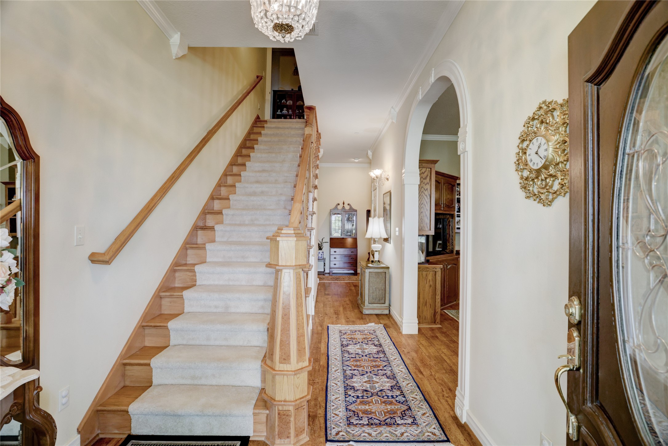 4854 Coshatte Road Bellville, TX 77418 - Photo 9 of 52 a view of a hallway with wooden floor and staircase