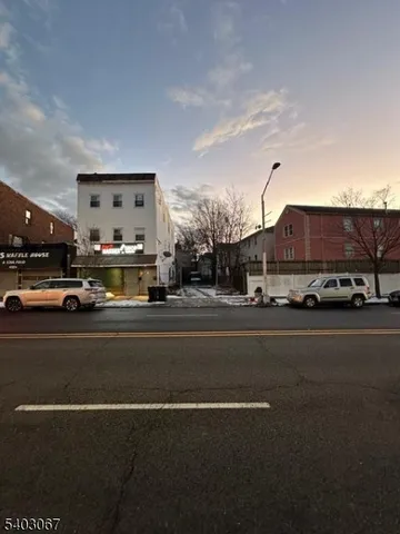 a view of a city street with cars