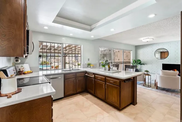 a kitchen with a table and chairs in it