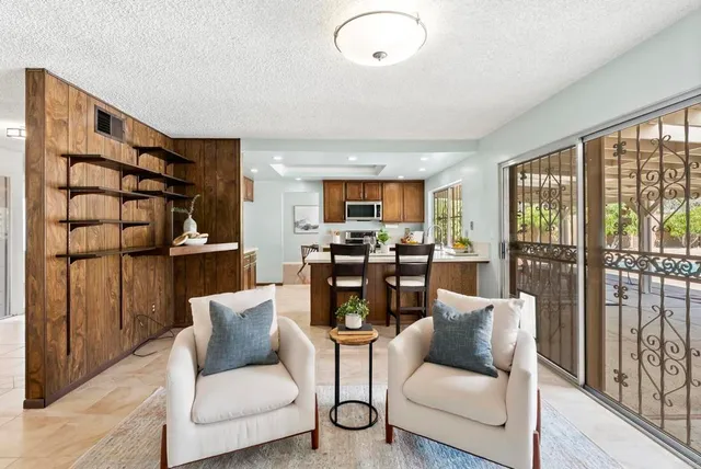 a bedroom with a bed and a night stand