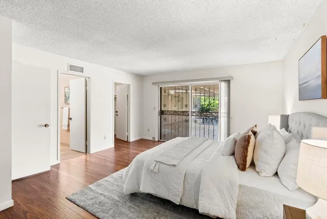 a bathroom with a double vanity sink toilet and shower
