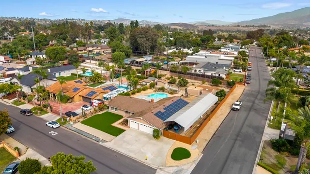 an aerial view of a house with a swimming pool