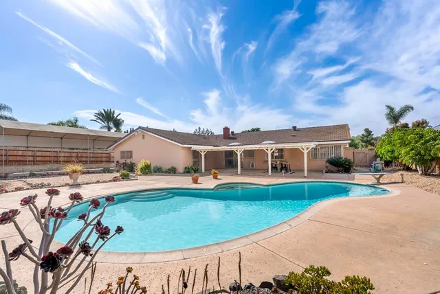 a view of a patio with swimming pool