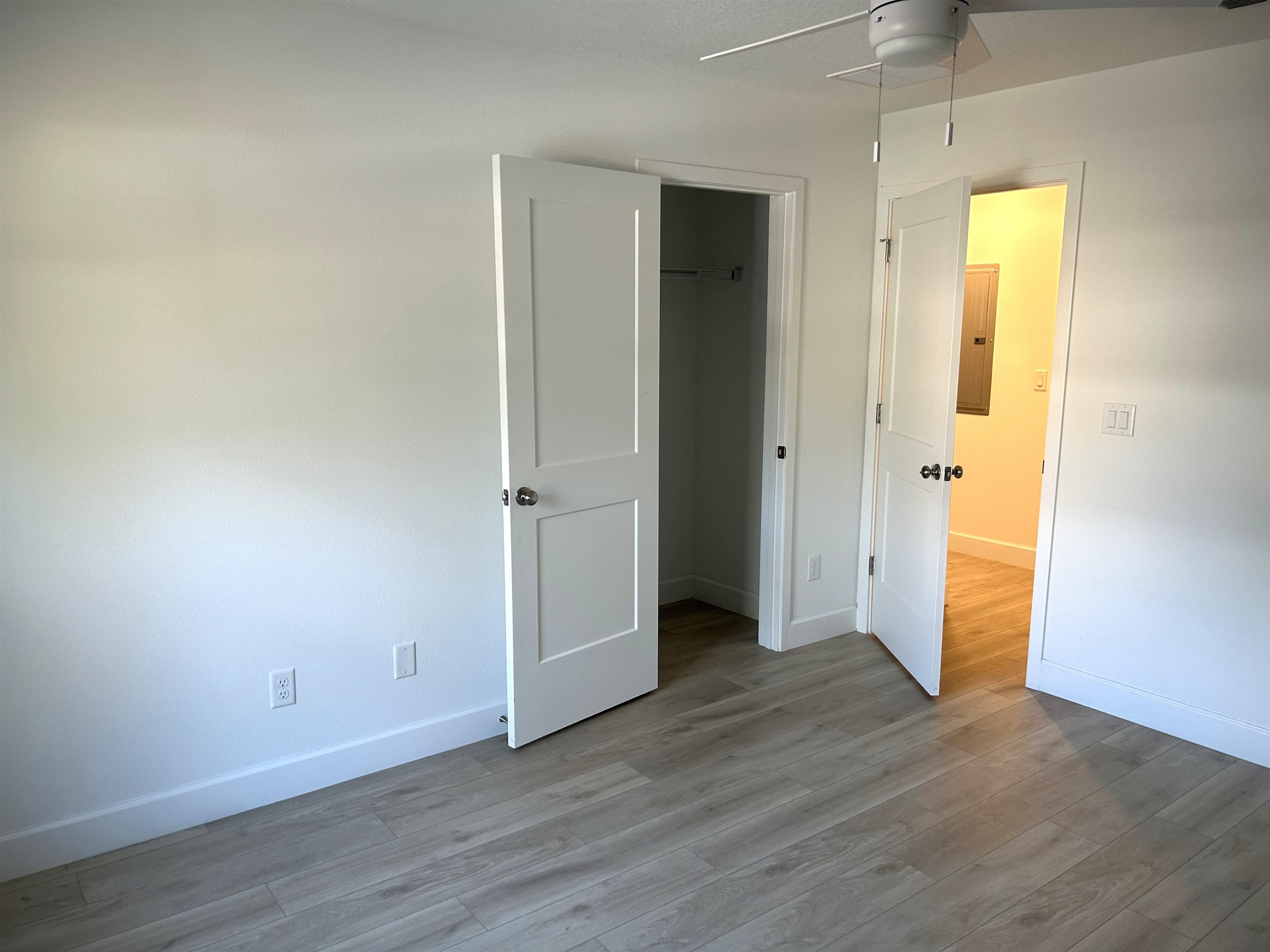 3347 7th Street Elkton, FL 32033 - Photo 10 of 17 an empty room with wooden floor and closet