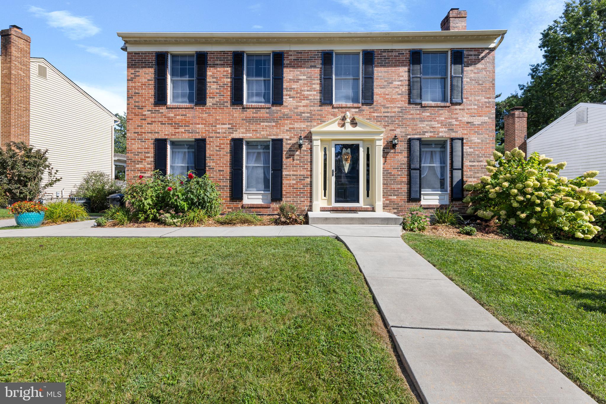9209 Ramblebrook Road Baltimore, MD 21236 - Photo 1 of 54 a front view of a house with yard and green space