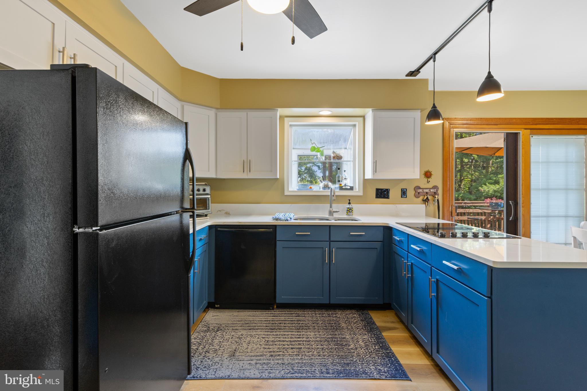 9209 Ramblebrook Road Baltimore, MD 21236 - Photo 12 of 54 a kitchen with stainless steel appliances granite countertop a refrigerator and a sink