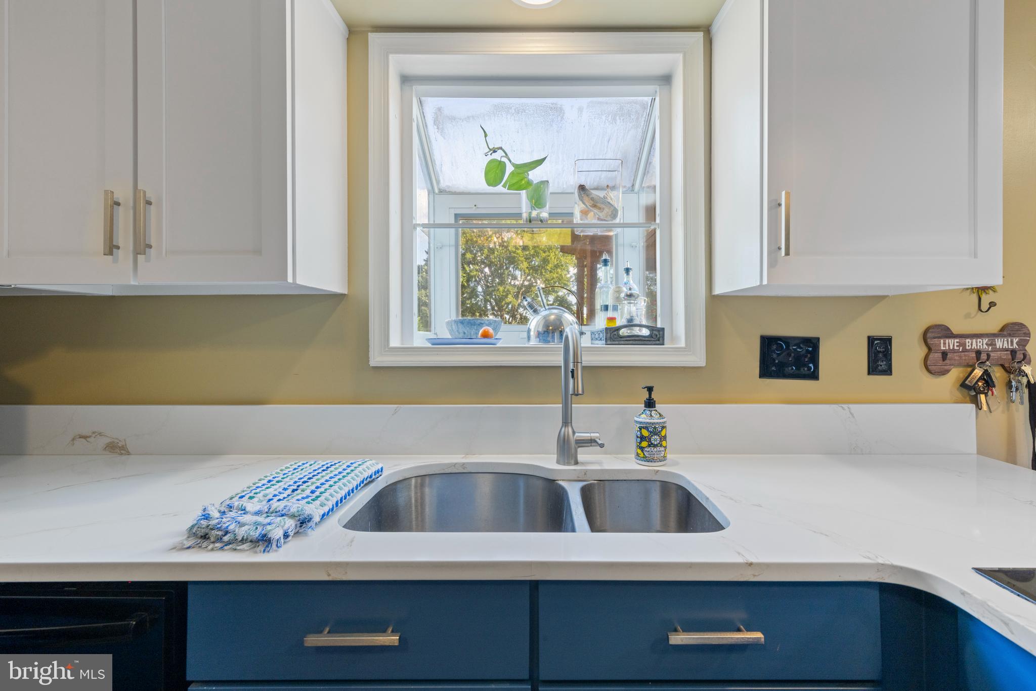 9209 Ramblebrook Road Baltimore, MD 21236 - Photo 13 of 54 a bathroom with a sink and a mirror