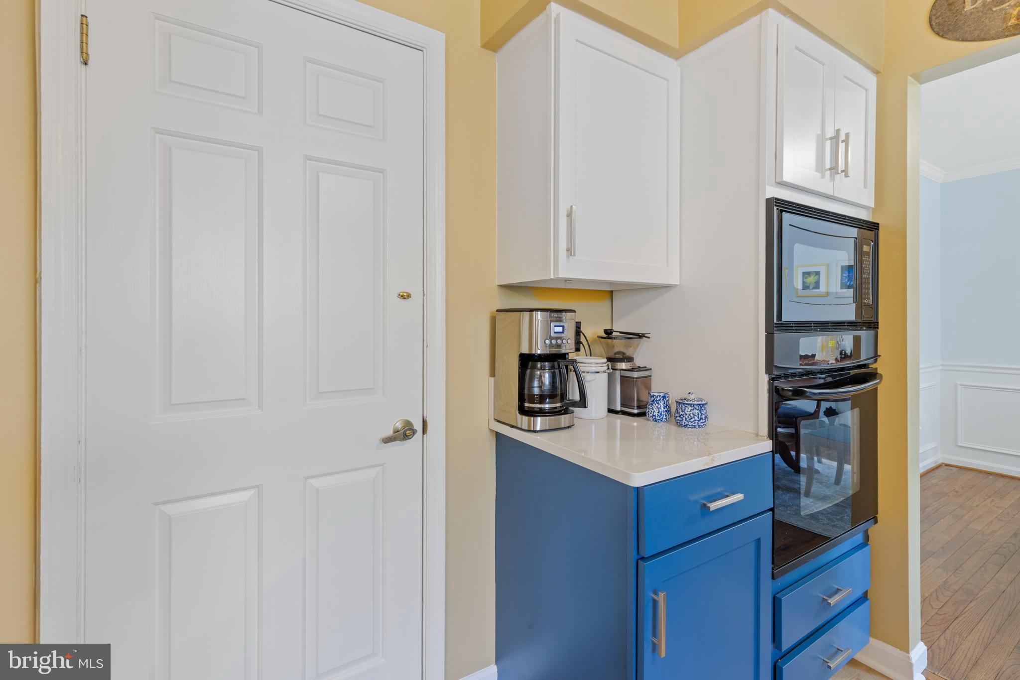 9209 Ramblebrook Road Baltimore, MD 21236 - Photo 15 of 54 a kitchen with cabinets and a refrigerator