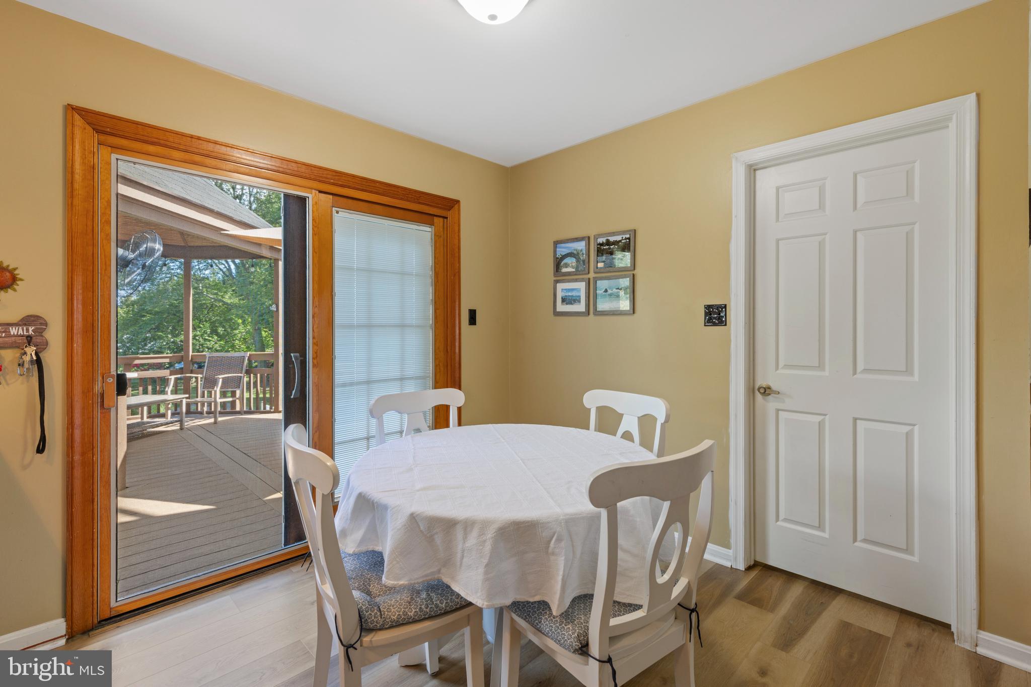 9209 Ramblebrook Road Baltimore, MD 21236 - Photo 16 of 54 a view of a dining room with furniture window and outside view