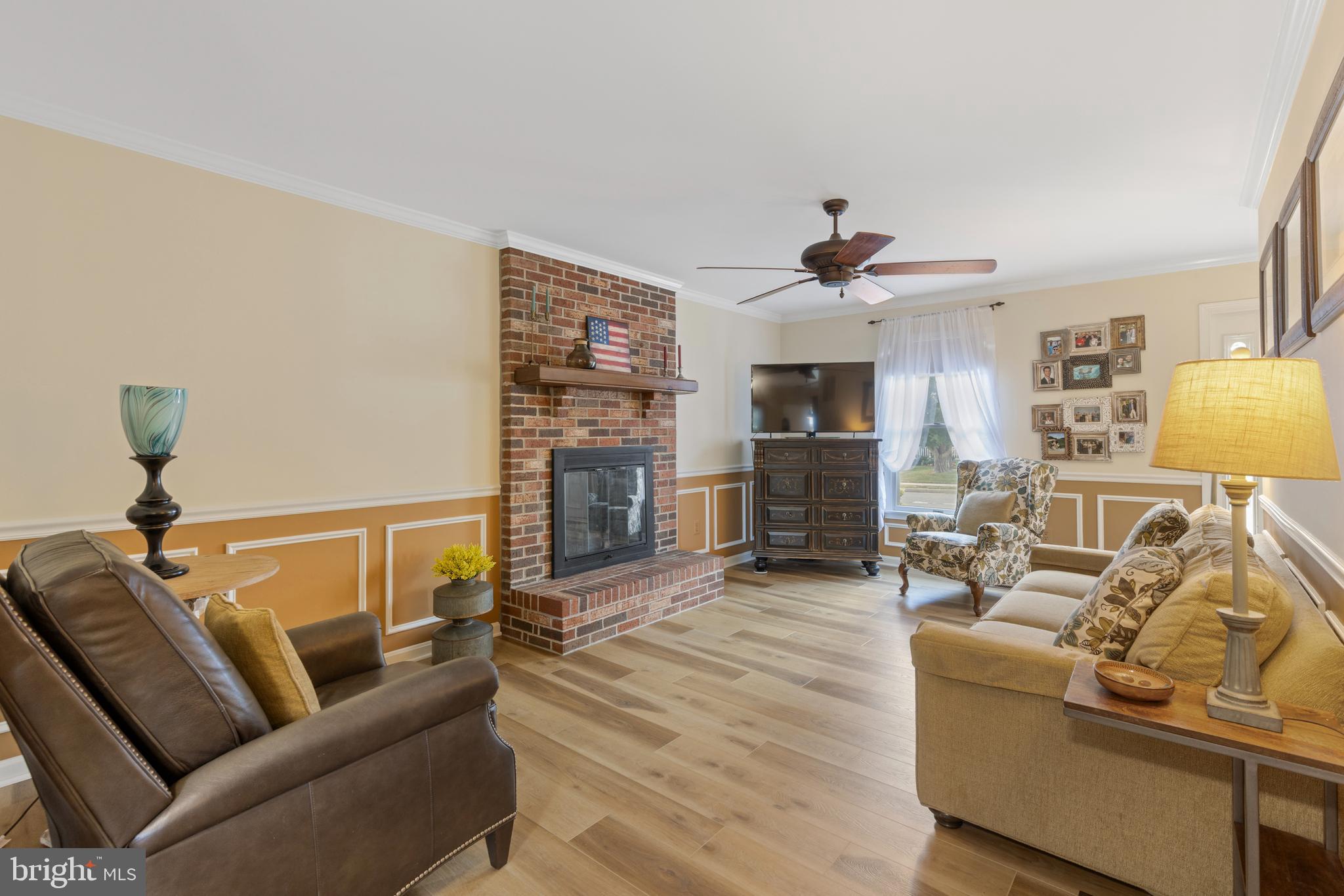 9209 Ramblebrook Road Baltimore, MD 21236 - Photo 17 of 54 a living room with furniture and a fireplace