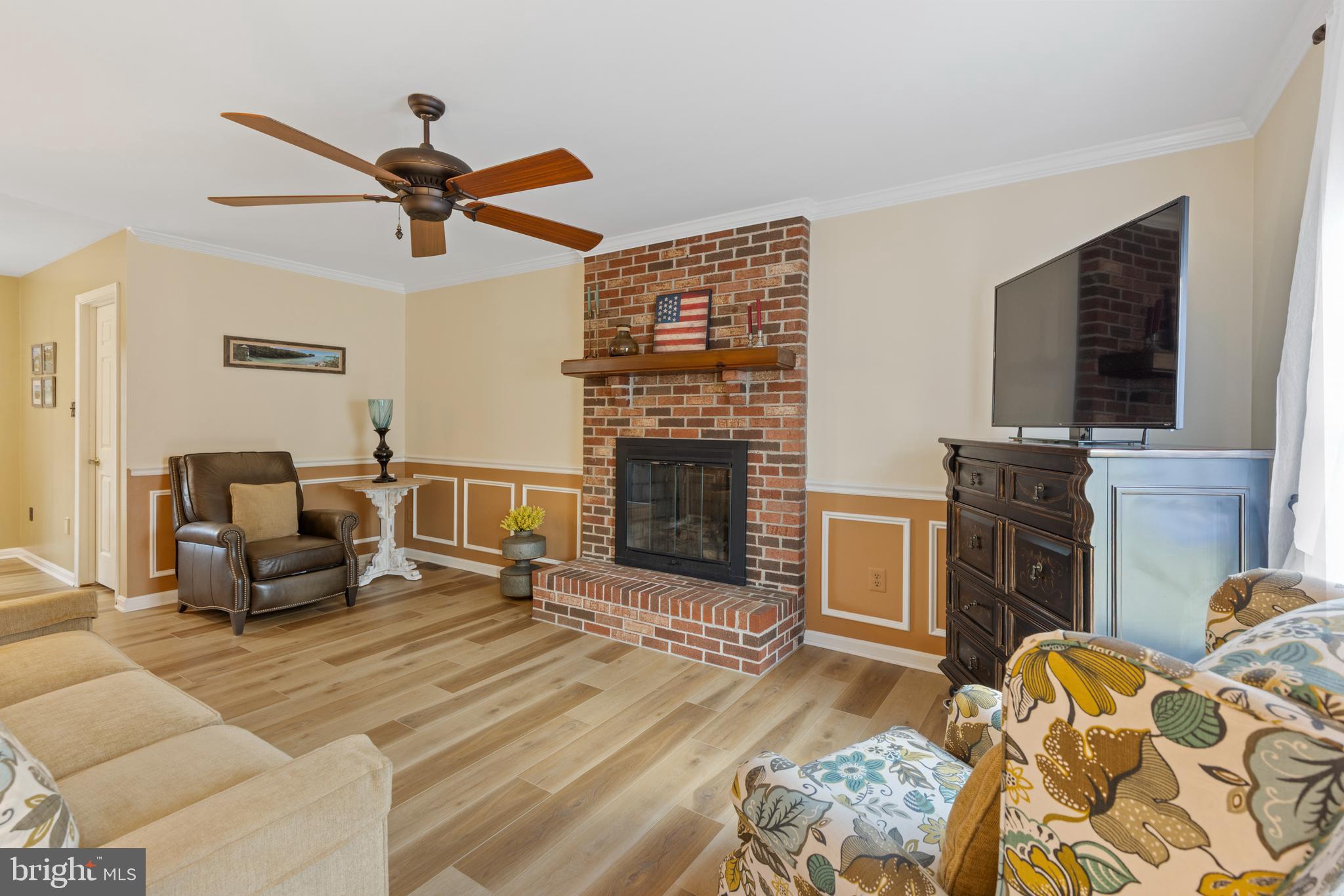 9209 Ramblebrook Road Baltimore, MD 21236 - Photo 18 of 54 a living room with furniture and a fireplace