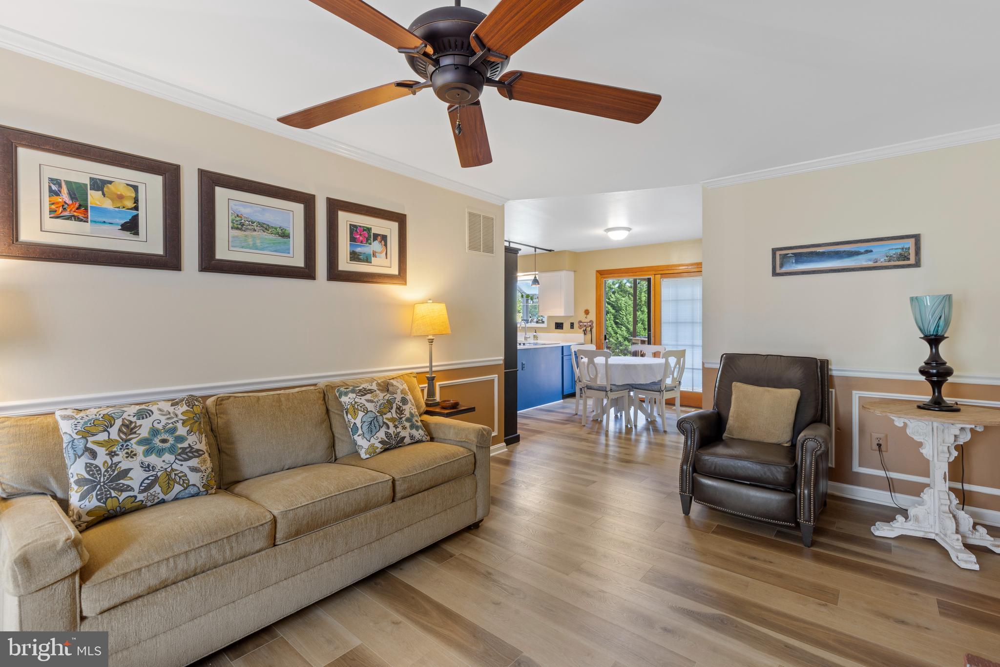 9209 Ramblebrook Road Baltimore, MD 21236 - Photo 19 of 54 a living room with furniture and a wooden floor