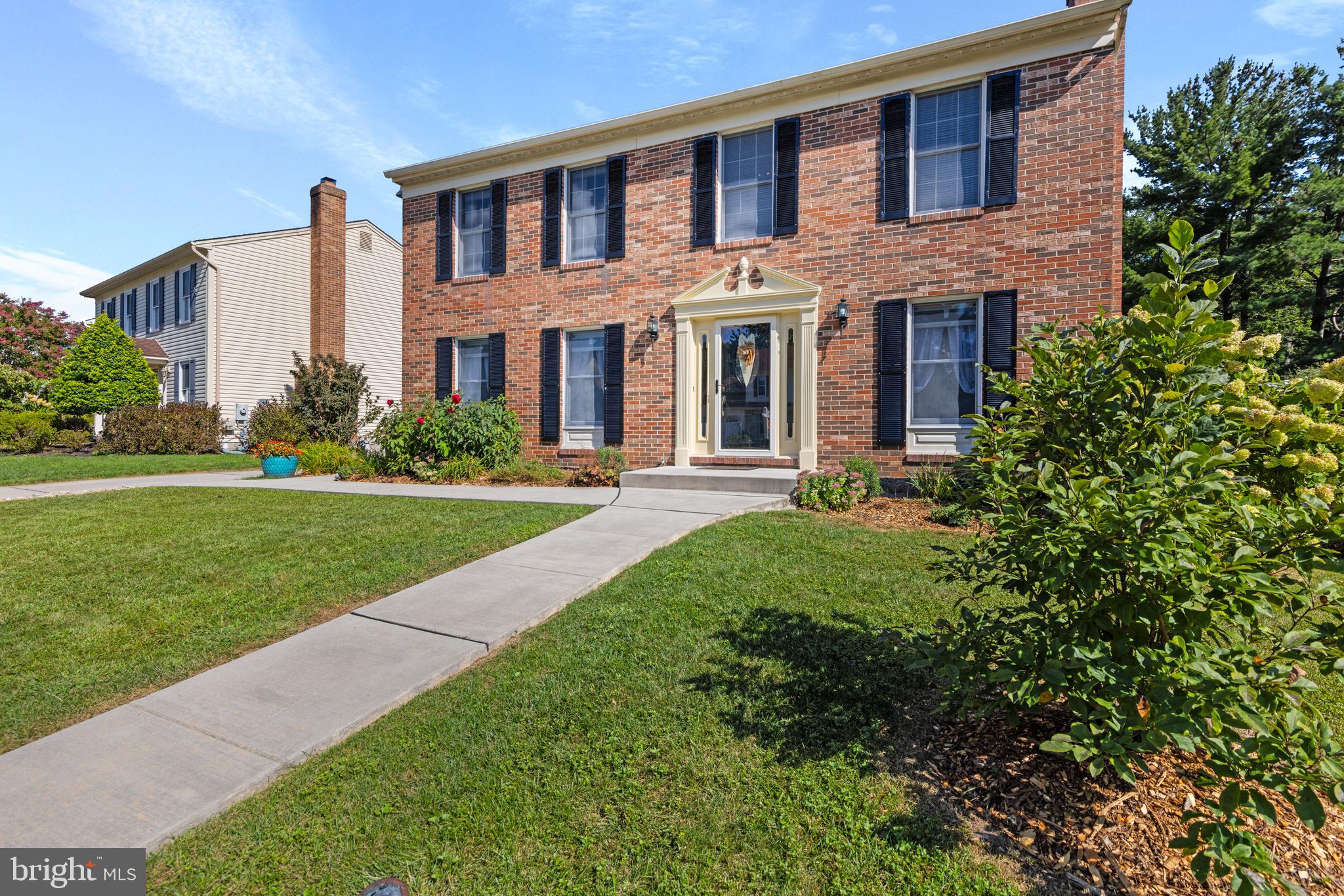 9209 Ramblebrook Road Baltimore, MD 21236 - Photo 2 of 54 a front view of a building with garden