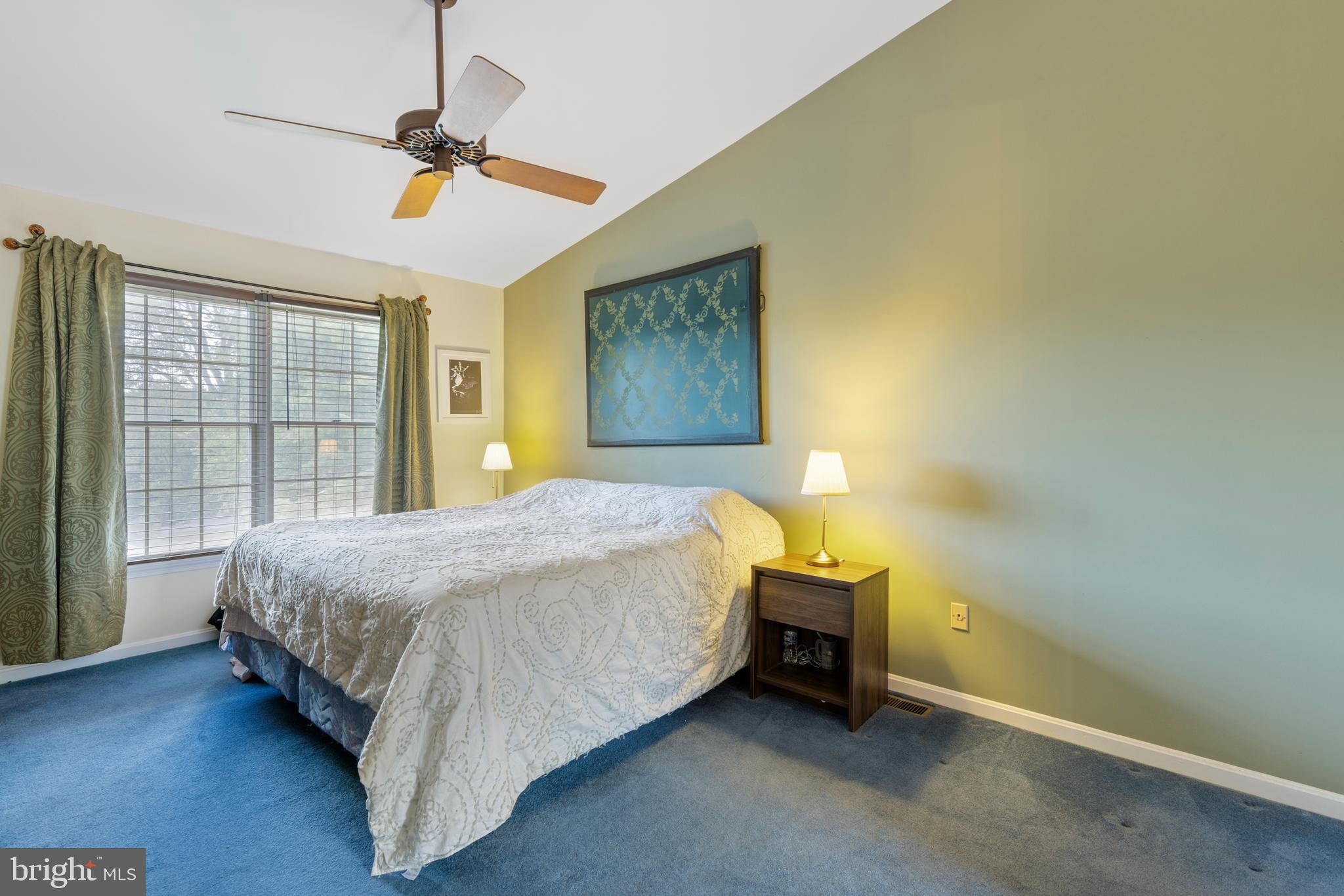9209 Ramblebrook Road Baltimore, MD 21236 - Photo 23 of 54 a bed sitting in a spacious bedroom next to a window