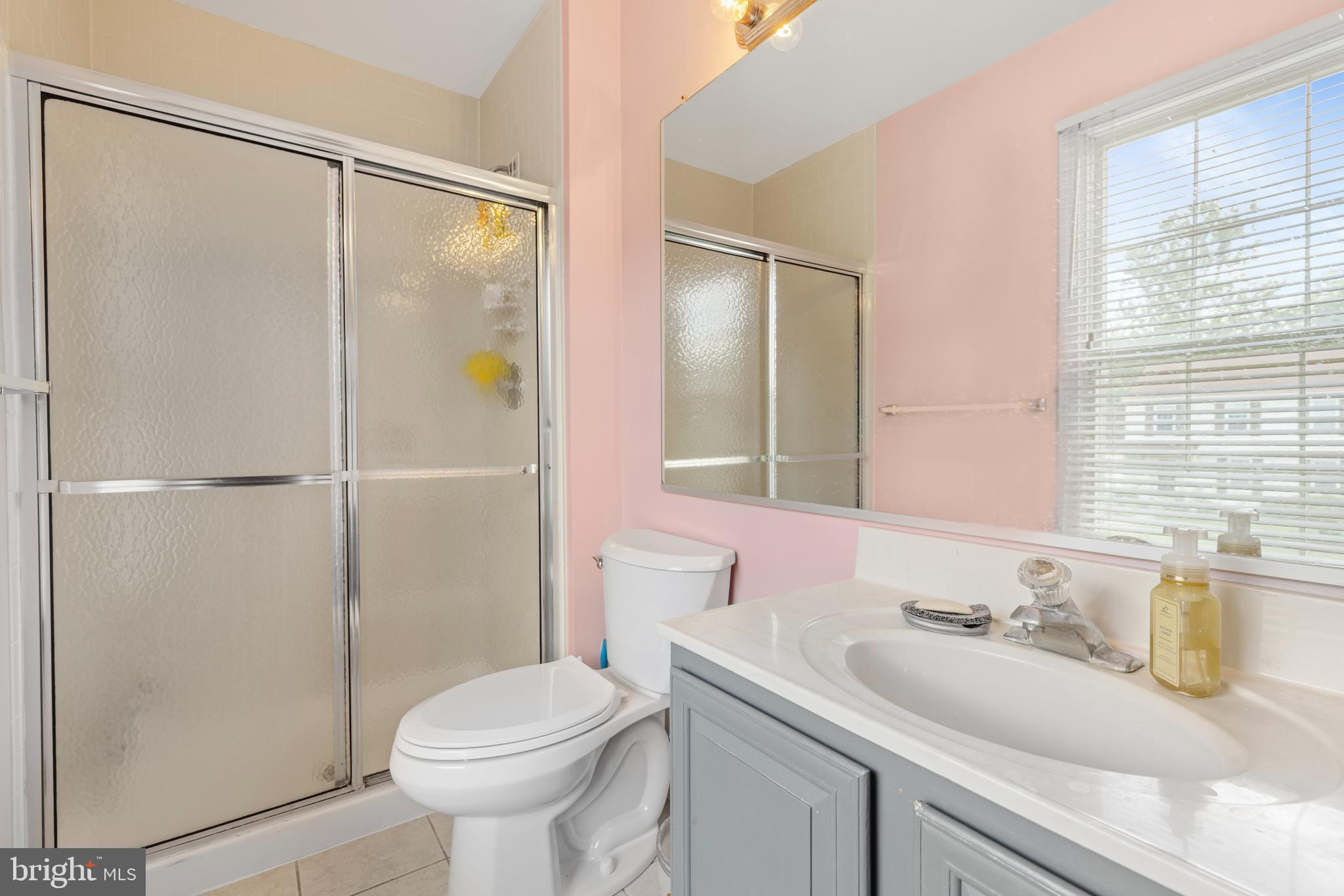 9209 Ramblebrook Road Baltimore, MD 21236 - Photo 28 of 54 a bathroom with a sink toilet and shower