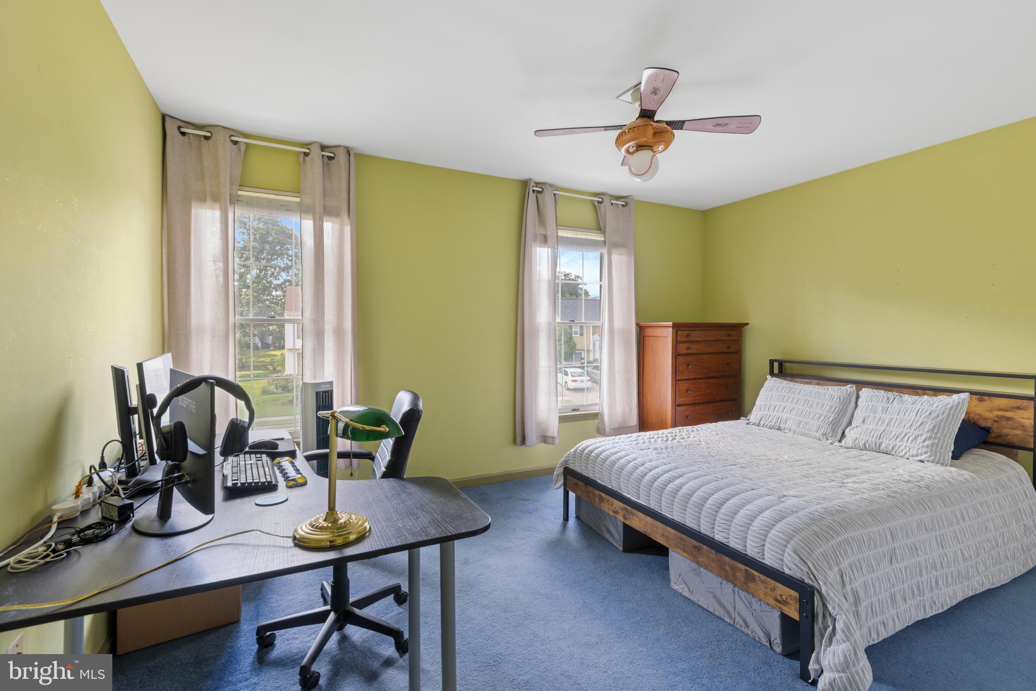 9209 Ramblebrook Road Baltimore, MD 21236 - Photo 29 of 54 a bedroom with a bed and a table