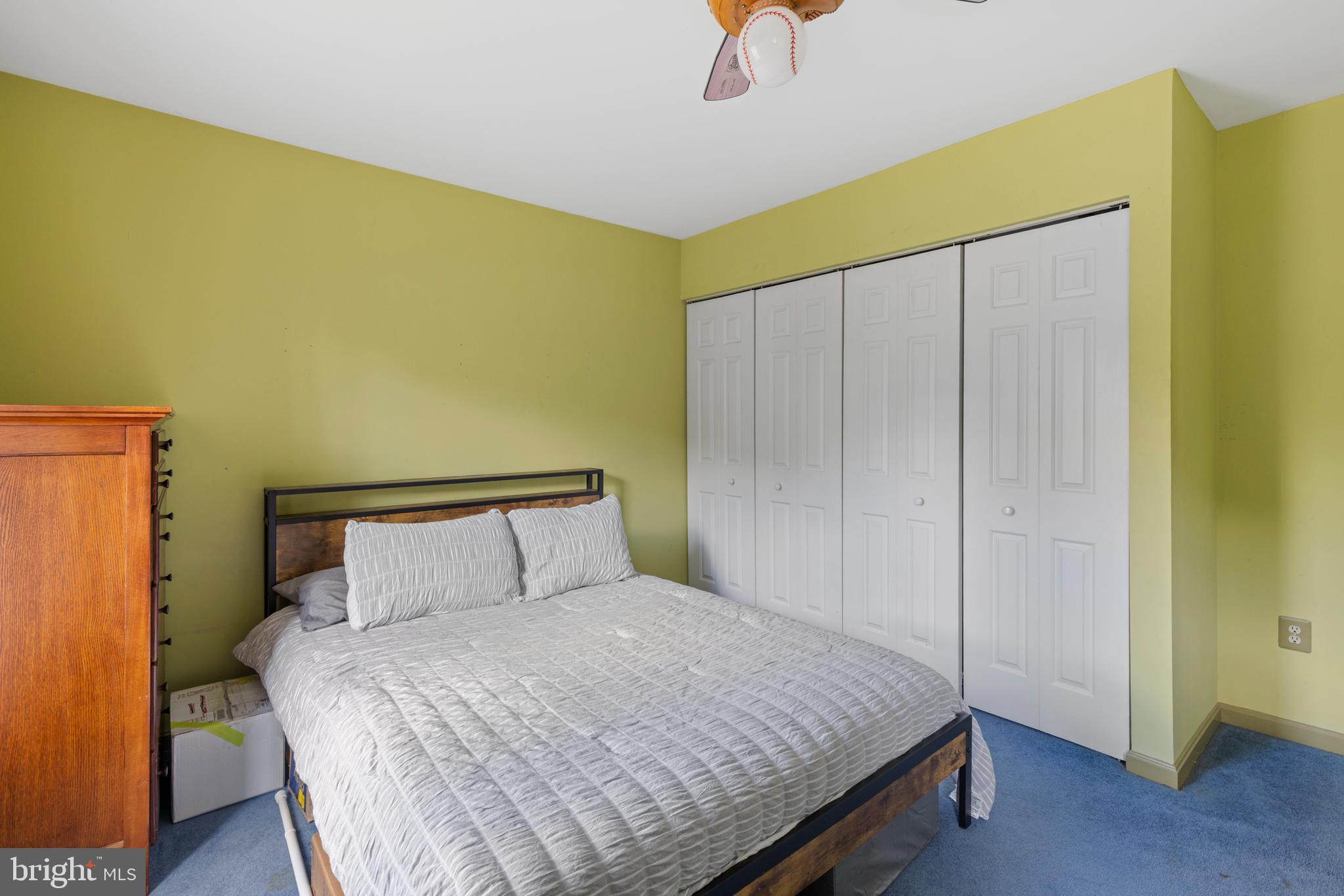 9209 Ramblebrook Road Baltimore, MD 21236 - Photo 30 of 54 a bedroom with a bed and wooden floor